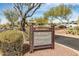 Community amenities sign for the Golf Shop, Restaurant, and Fitness center, surrounded by desert foliage at 42017 N Crooked Stick Rd, Anthem, AZ 85086