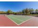 Well-maintained tennis court with excellent lighting and green and red surface at 42017 N Crooked Stick Rd, Anthem, AZ 85086
