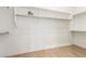 Walk-in closet features custom shelving and wood flooring at 42017 N Crooked Stick Rd, Anthem, AZ 85086