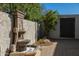 Outdoor fountain feature surrounded by lush greenery and brick paving at 4340 E Turquoise Ave, Phoenix, AZ 85028