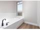 Clean bathroom with white subway tile and a modern bathtub at 4446 W Townley Ave, Glendale, AZ 85302
