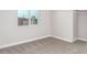 Bright bedroom with carpet flooring and a window at 4446 W Townley Ave, Glendale, AZ 85302