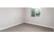 Spacious bedroom featuring a window and carpet at 4446 W Townley Ave, Glendale, AZ 85302