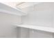White shelving and hanging rods in this spacious closet at 4446 W Townley Ave, Glendale, AZ 85302