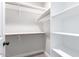 White shelves and hanging rods provide ample storage at 4446 W Townley Ave, Glendale, AZ 85302