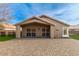 Home's back exterior showcasing a paved patio at 4446 W Townley Ave, Glendale, AZ 85302