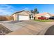 House exterior with attached garage and driveway at 4446 W Townley Ave, Glendale, AZ 85302