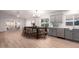 Modern kitchen with gray cabinets, an eat-in island, and luxury vinyl flooring at 4446 W Townley Ave, Glendale, AZ 85302
