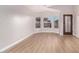 Spacious living room with wood-look floors and bay window at 4446 W Townley Ave, Glendale, AZ 85302