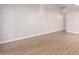 Bright living room featuring wood-look floors and neutral walls at 4446 W Townley Ave, Glendale, AZ 85302
