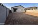 The back of the home includes a blank canvas back yard and covered patio at 47733 W Moeller Rd, Maricopa, AZ 85139
