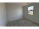 A bedroom with white walls and a window providing natural light at 47733 W Moeller Rd, Maricopa, AZ 85139