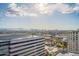 Aerial view of city buildings and parking lots with mountain range in the distance at 4808 N 24Th St # 305, Phoenix, AZ 85016