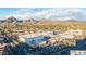 Aerial view of a shopping center and surrounding area with mountain views at 4808 N 24Th St # 305, Phoenix, AZ 85016