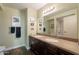 Double vanity bathroom with dark wood cabinets and tile floors at 4808 N 24Th St # 305, Phoenix, AZ 85016