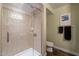 Shower stall with glass enclosure and tile surround at 4808 N 24Th St # 305, Phoenix, AZ 85016