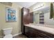 Bathroom with dark wood vanity and toilet at 4808 N 24Th St # 305, Phoenix, AZ 85016