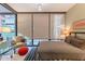 Bedroom with city view and large window coverings at 4808 N 24Th St # 305, Phoenix, AZ 85016