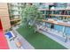 Lush green courtyard with trees and a fountain at 4808 N 24Th St # 305, Phoenix, AZ 85016
