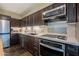 Modern kitchen with stainless steel appliances and granite countertops at 4808 N 24Th St # 305, Phoenix, AZ 85016