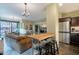 Modern kitchen with stainless steel appliances and breakfast bar at 4808 N 24Th St # 305, Phoenix, AZ 85016