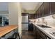 Modern kitchen with stainless steel appliances and granite countertops at 4808 N 24Th St # 305, Phoenix, AZ 85016