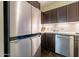 Modern kitchen with stainless steel refrigerator and granite countertops at 4808 N 24Th St # 305, Phoenix, AZ 85016