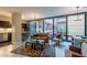 Open living area with leather sofa, large windows, and city views at 4808 N 24Th St # 305, Phoenix, AZ 85016