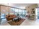 Open living area with leather sofa, large windows, and city views at 4808 N 24Th St # 305, Phoenix, AZ 85016