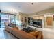 Open living area with leather sofa and modern shelving unit at 4808 N 24Th St # 305, Phoenix, AZ 85016