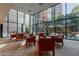 Comfortable lounge area with leather armchairs and large windows at 4808 N 24Th St # 305, Phoenix, AZ 85016