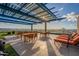 Outdoor rooftop terrace with lounge chairs, tables, and city views at 4808 N 24Th St # 305, Phoenix, AZ 85016