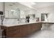 Elegant bathroom with double vanity, marble countertops, and large mirror at 5419 E Valle Vista Rd, Phoenix, AZ 85018