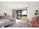 Bright bedroom with sliding glass doors opening to a view at 5419 E Valle Vista Rd, Phoenix, AZ 85018