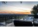 Modern deck furniture overlooks city skyline at sunset at 5419 E Valle Vista Rd, Phoenix, AZ 85018