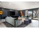 Relaxing Gathering room with plush sofas and large TV at 5419 E Valle Vista Rd, Phoenix, AZ 85018