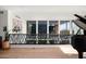 Bright hallway with large windows, hardwood floors and modern railing at 5419 E Valle Vista Rd, Phoenix, AZ 85018