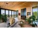 Spacious living room with wood ceilings, fireplace, and stunning views at 5419 E Valle Vista Rd, Phoenix, AZ 85018