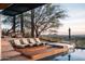 Inviting pool and spa with a wooden deck and city views at 5419 E Valle Vista Rd, Phoenix, AZ 85018