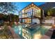 Luxury home with a stunning pool and mountain views at dusk at 5419 E Valle Vista Rd, Phoenix, AZ 85018