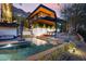 Luxury pool and home with a wooden deck and spa at 5419 E Valle Vista Rd, Phoenix, AZ 85018