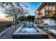 Expansive pool and spa with city views at sunset at 5419 E Valle Vista Rd, Phoenix, AZ 85018