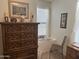 Cozy bedroom featuring a dresser, window seat, and chair at 5518 E Lindstrom Ln # 2004, Mesa, AZ 85215