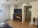 Living room with hardwood floors and a flat-screen TV at 5518 E Lindstrom Ln # 2004, Mesa, AZ 85215