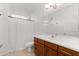 Clean bathroom with wood vanity, shower/tub combo, and tile floor at 6605 N 93Rd Ave # 1070, Glendale, AZ 85305