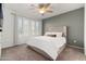 Spacious bedroom with a king-size bed, ceiling fan, and neutral wall colors at 6605 N 93Rd Ave # 1070, Glendale, AZ 85305