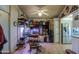 A pleasant dining area adjoins the kitchen and features shelving and a stainless steel refrigerator at 7750 E Broadway Rd # 714, Mesa, AZ 85208