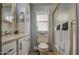 Well-lit bathroom with vanity, toilet, and enclosed shower at 7750 E Broadway Rd # 906, Mesa, AZ 85208