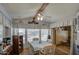 Cozy dining area with natural light and a ceiling fan above the table at 7750 E Broadway Rd # 906, Mesa, AZ 85208