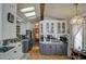 Modern kitchen with stainless steel appliances, skylight, and ample cabinet space at 7750 E Broadway Rd # 906, Mesa, AZ 85208